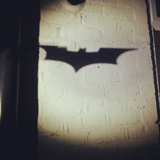 The Bat-signal projected in the night sky