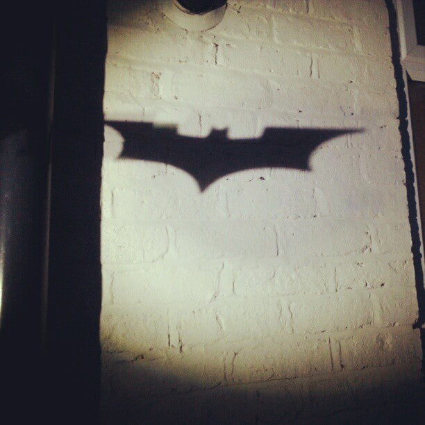 The Bat-signal projected in the night sky