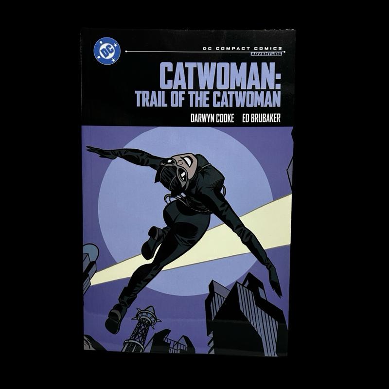 Comic book cover of 'Catwoman: Trail of the Catwoman' with a superhero in action pose.
