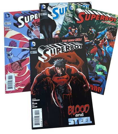 Superboy comic books on a wooden surface