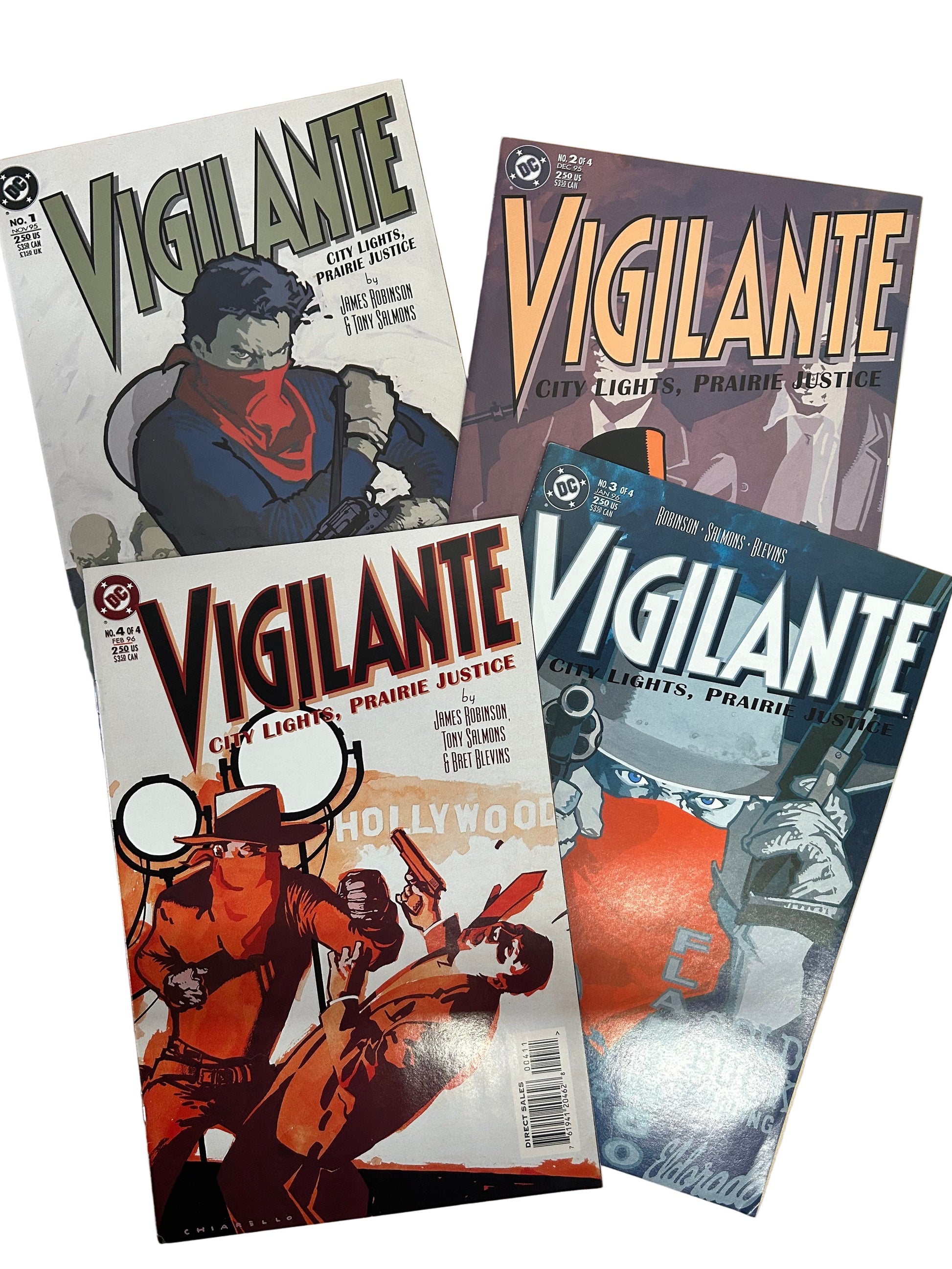 Four 'Vigilante' comic books on a wooden surface