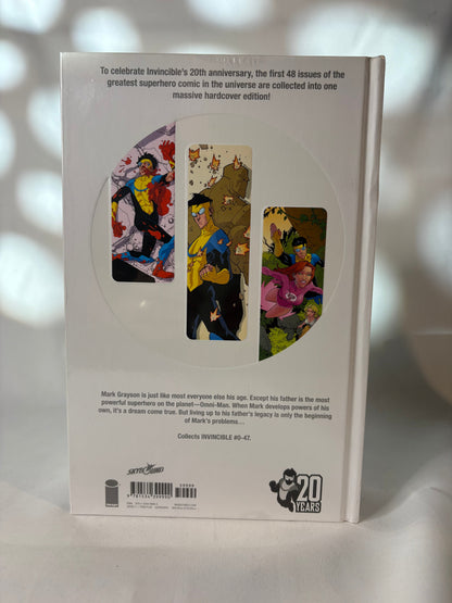 Invincible hardcover compendium spines showing volume 1 2 3