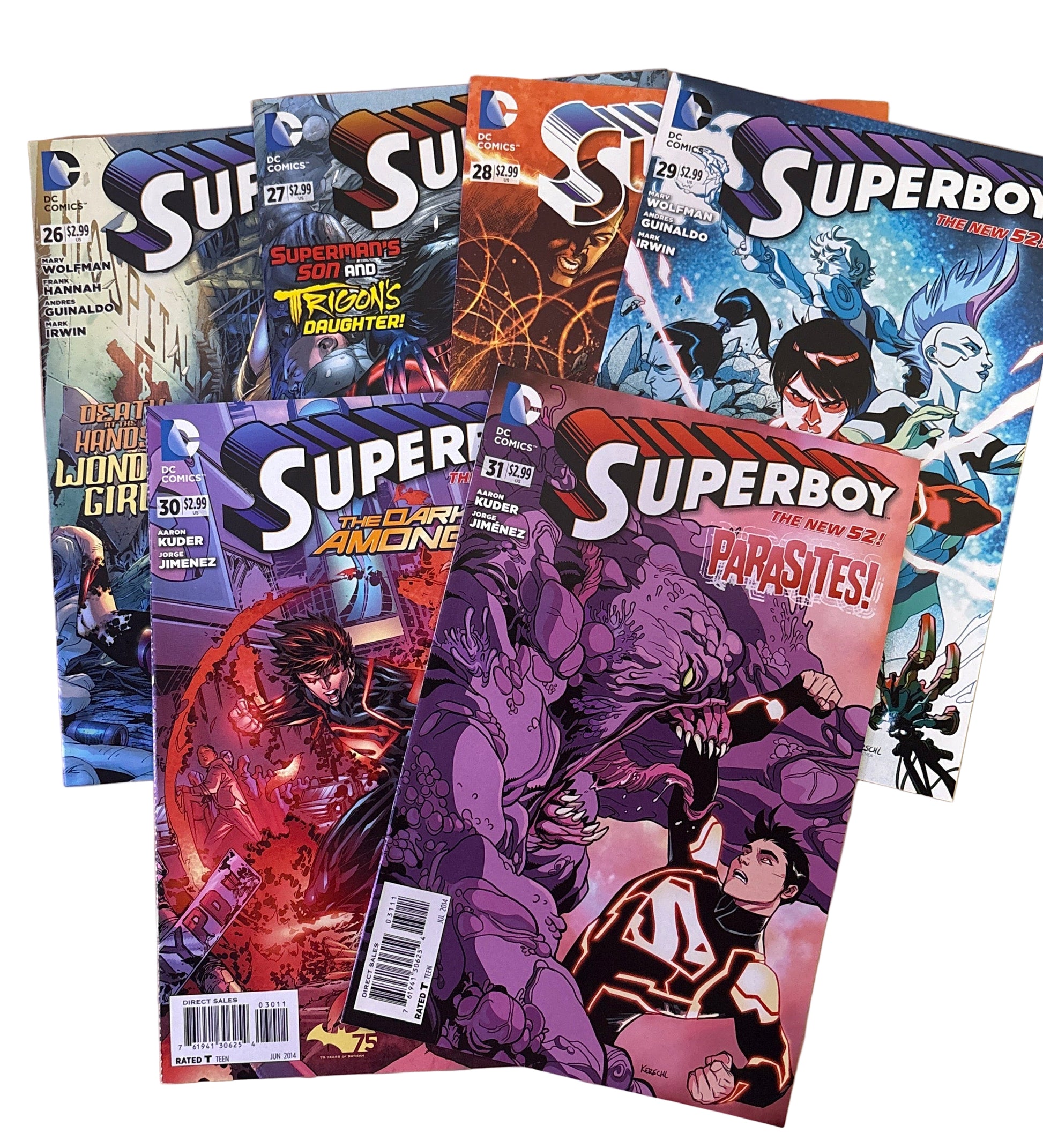 Superboy comic books on a wooden surface
