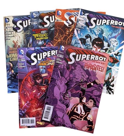 Superboy comic books on a wooden surface